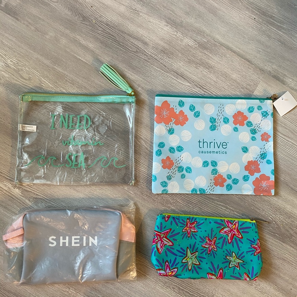 4 NWOT make up/travel bags